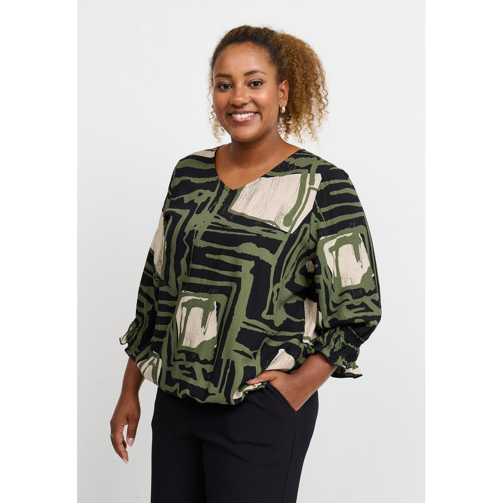 Grön blus med grafiskt mönster